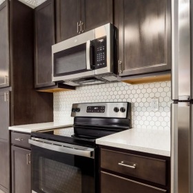 a kitchen with black appliances