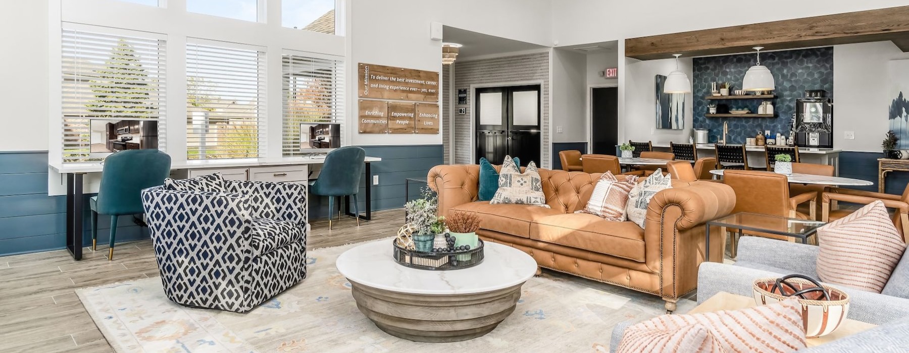 a living room with a large chandelier and a large couch