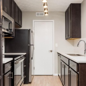 a kitchen with black appliances