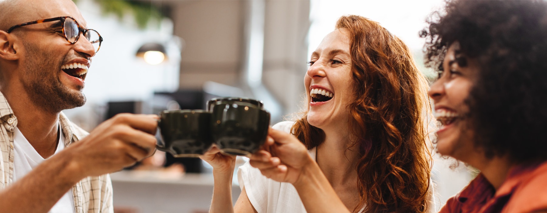 people drinking coffee and laughing 